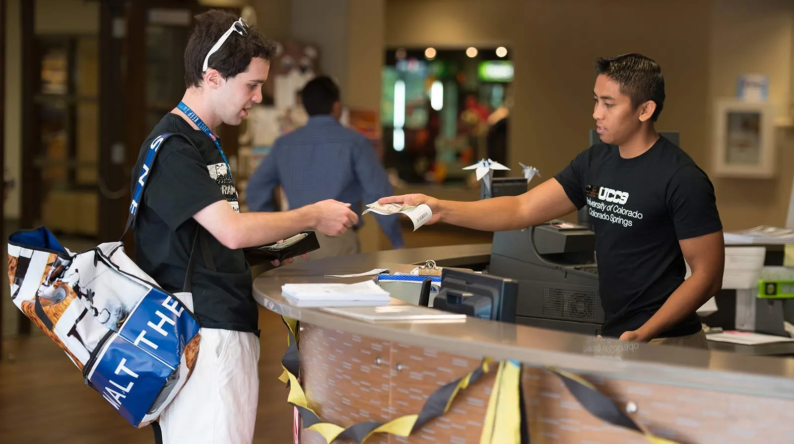 student at the info desk